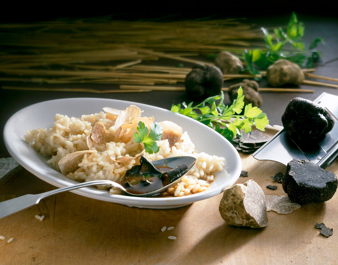 Truffle risotto with potato and parsley on plate