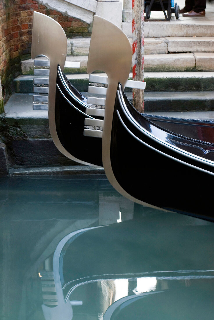 Close-up of tip of Gondola with ornate decoration at Venice, Italy