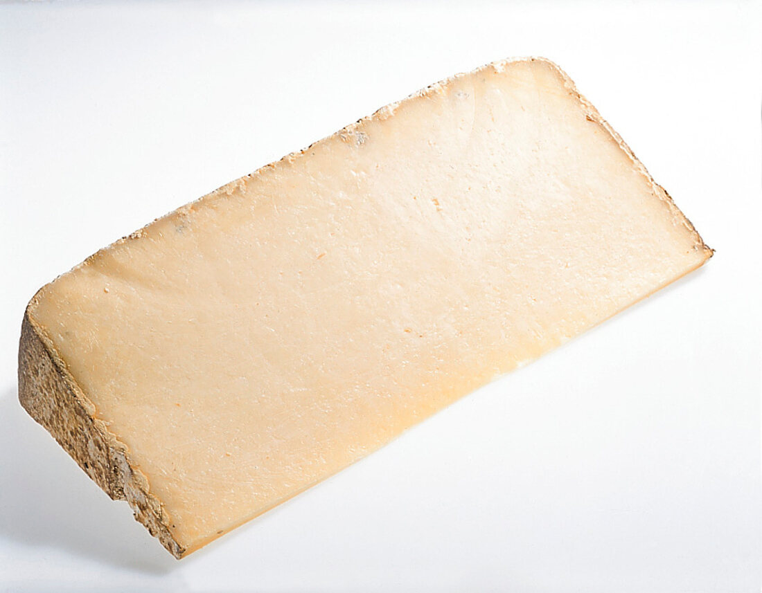 Buch vom Käse, Stück Käse, hellgelb, Rinde, "Laguiole Aubrac"