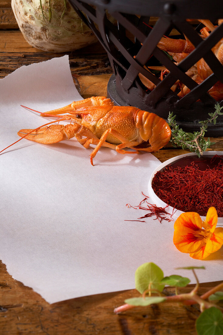 Crayfish and saffron threads on paper