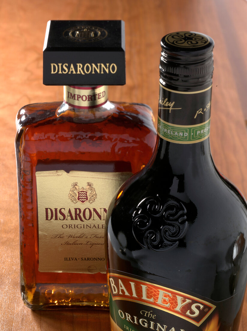 Close-up of two bottles of cream and digestive liqueur