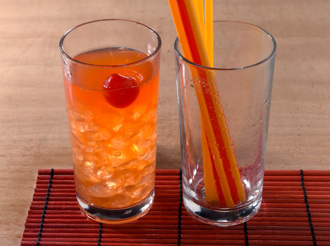 Zombie drink and straws in glass