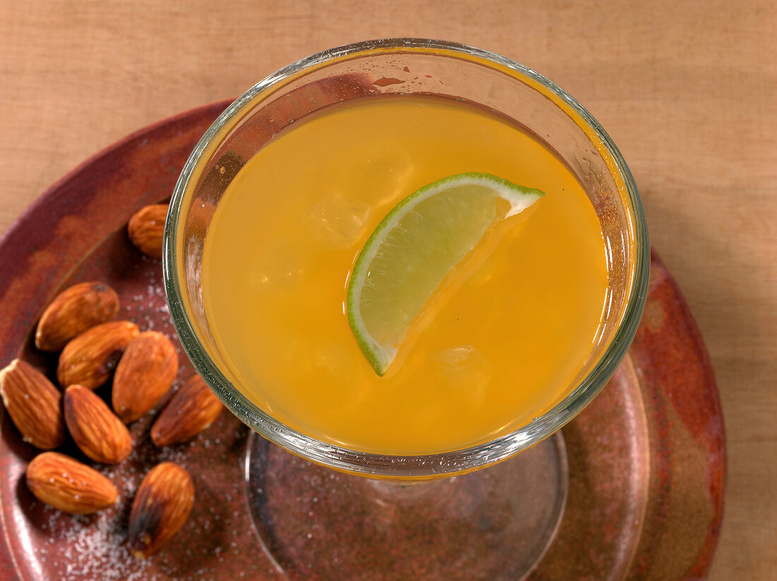 Hurricane drink with lemon slice in glass