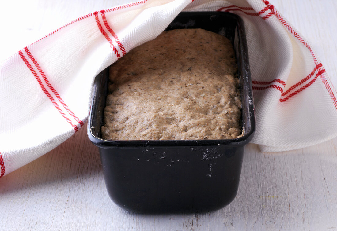 Raised and baked bread in baking tin