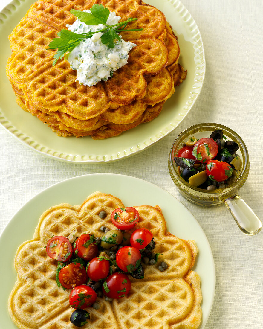 Waffles with greencore olive dip and pumpkin waffles on plates