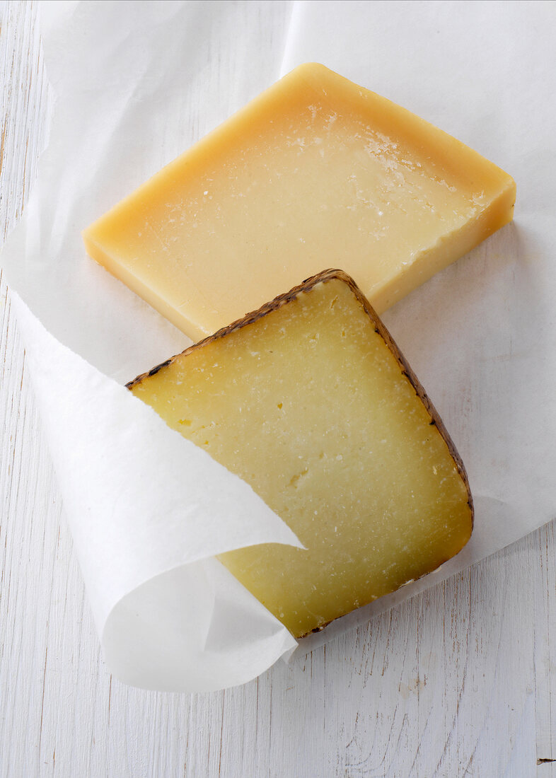 Pecorino and parmesan cheese on wax paper