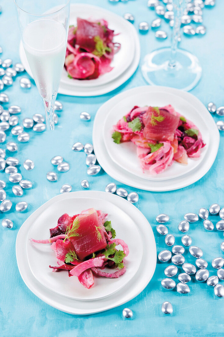 Beetroot salad with potatoes, veal cutlets and fennel on plate