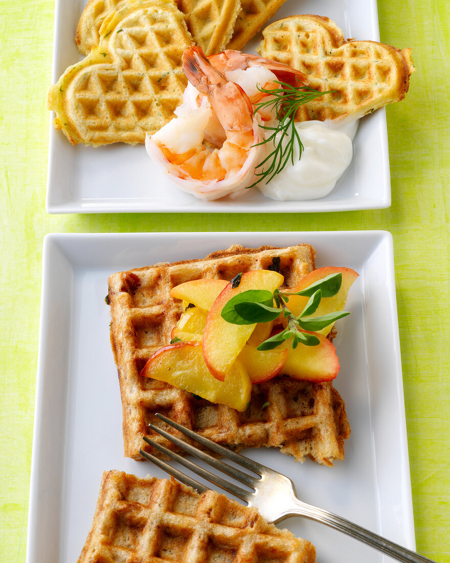Heart shaped waffles with shrimp and dill and potato waffles on plate