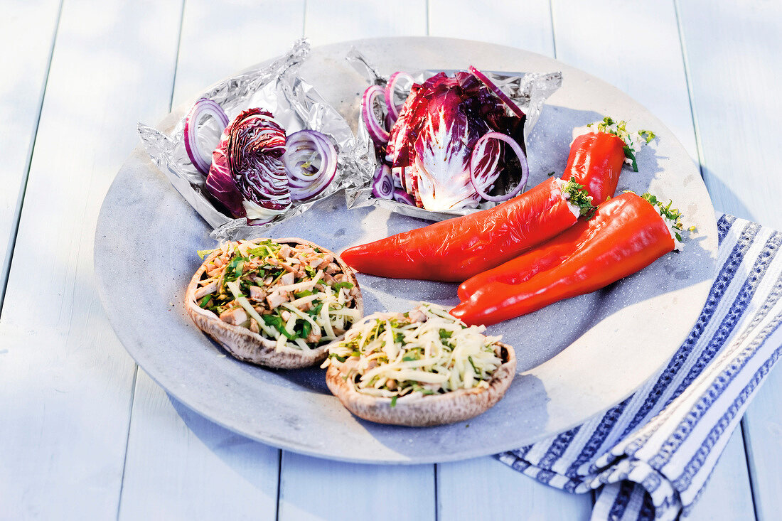 Wild rice, radicchio and stuffed green peppers with herbs and cheese served on plate