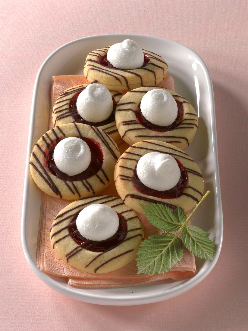 Raspberry clouds biscuits with mint leaf on plate