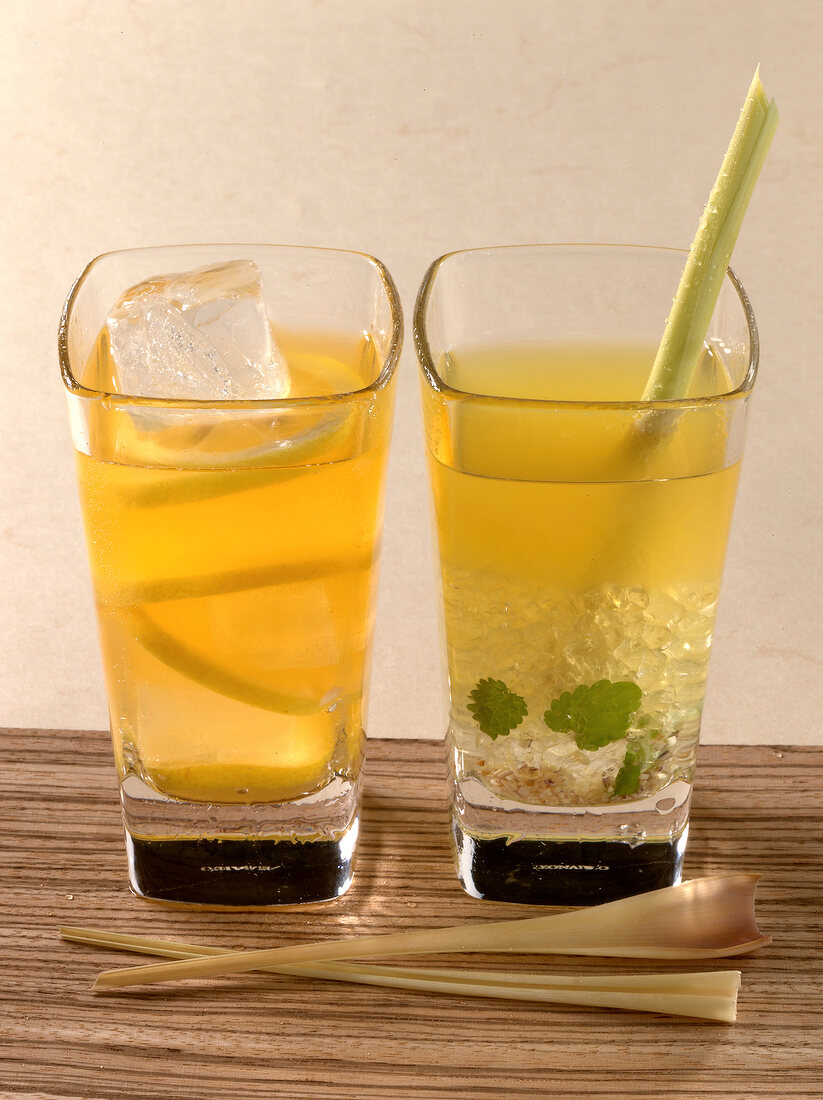 Peachy iced tea and green lemon tree drinks in glasses