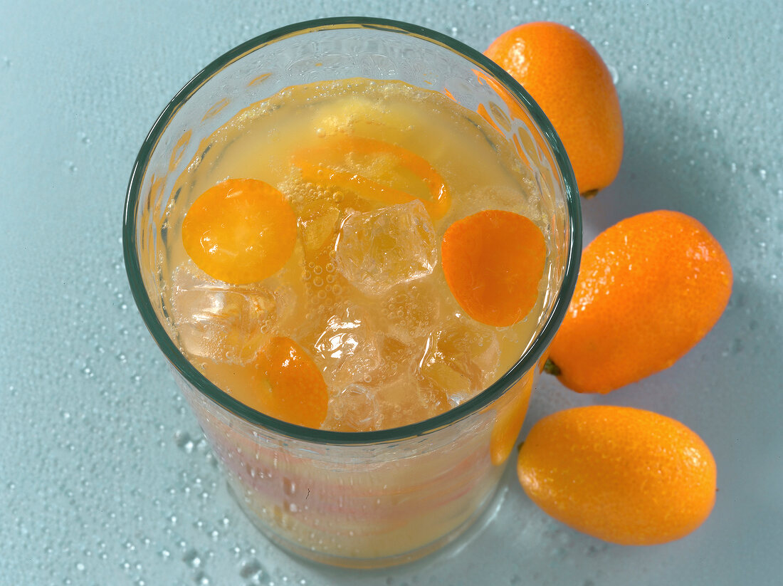 Girls With Plan drink with kumquats and ice in glass