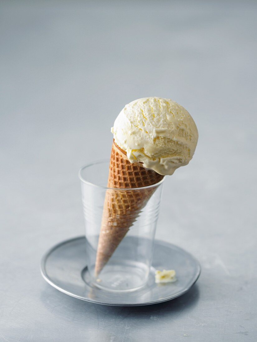 Scoop of vanilla ice cream in a cone
