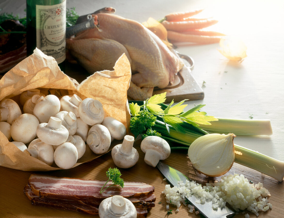 Close-up of chicken, mushrooms, onion, ham and herbs