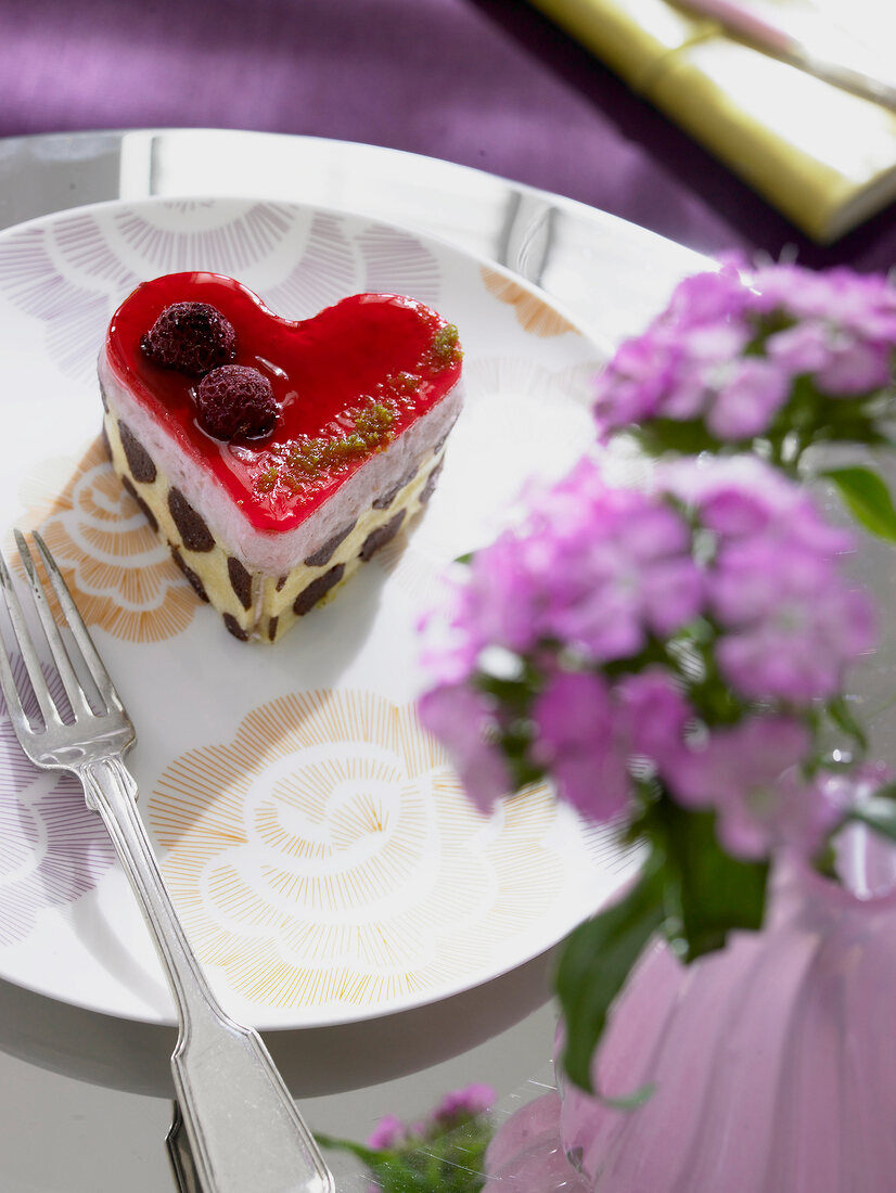 Heart shaped cream cake on plate