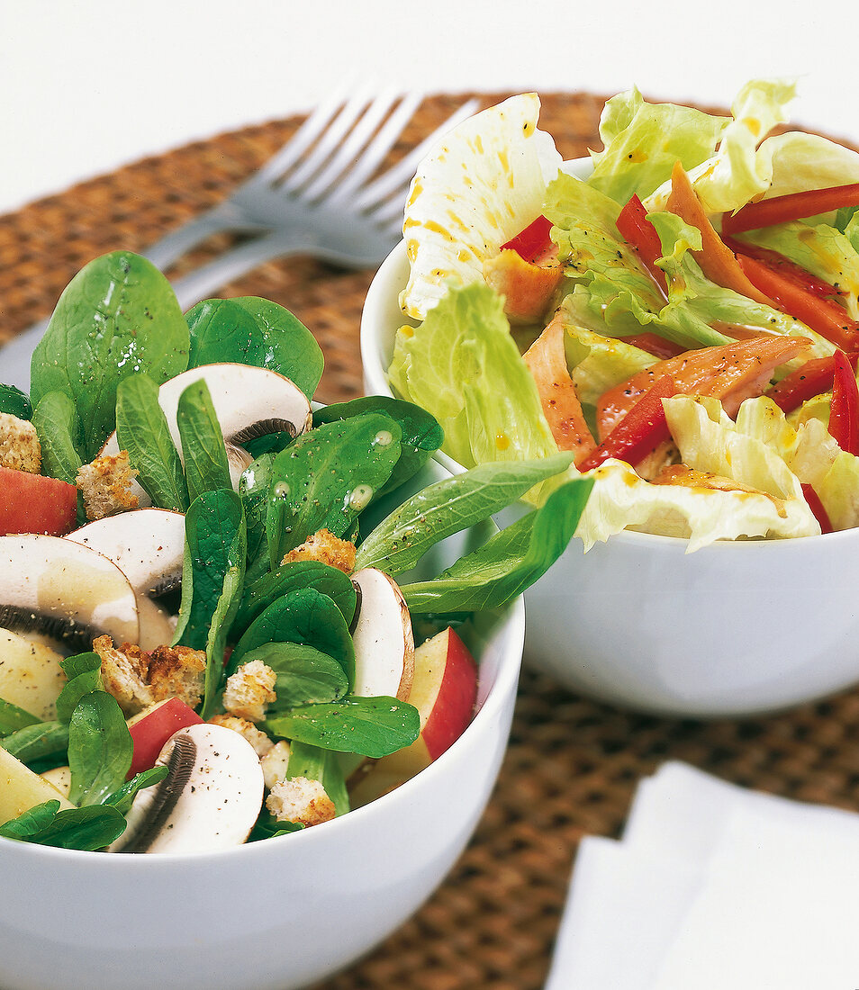 Close-up of salad with apples, mushrooms and turkey breast in bowl