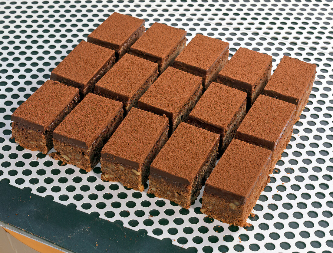 Slices of chocolate brownies with cocoa powder