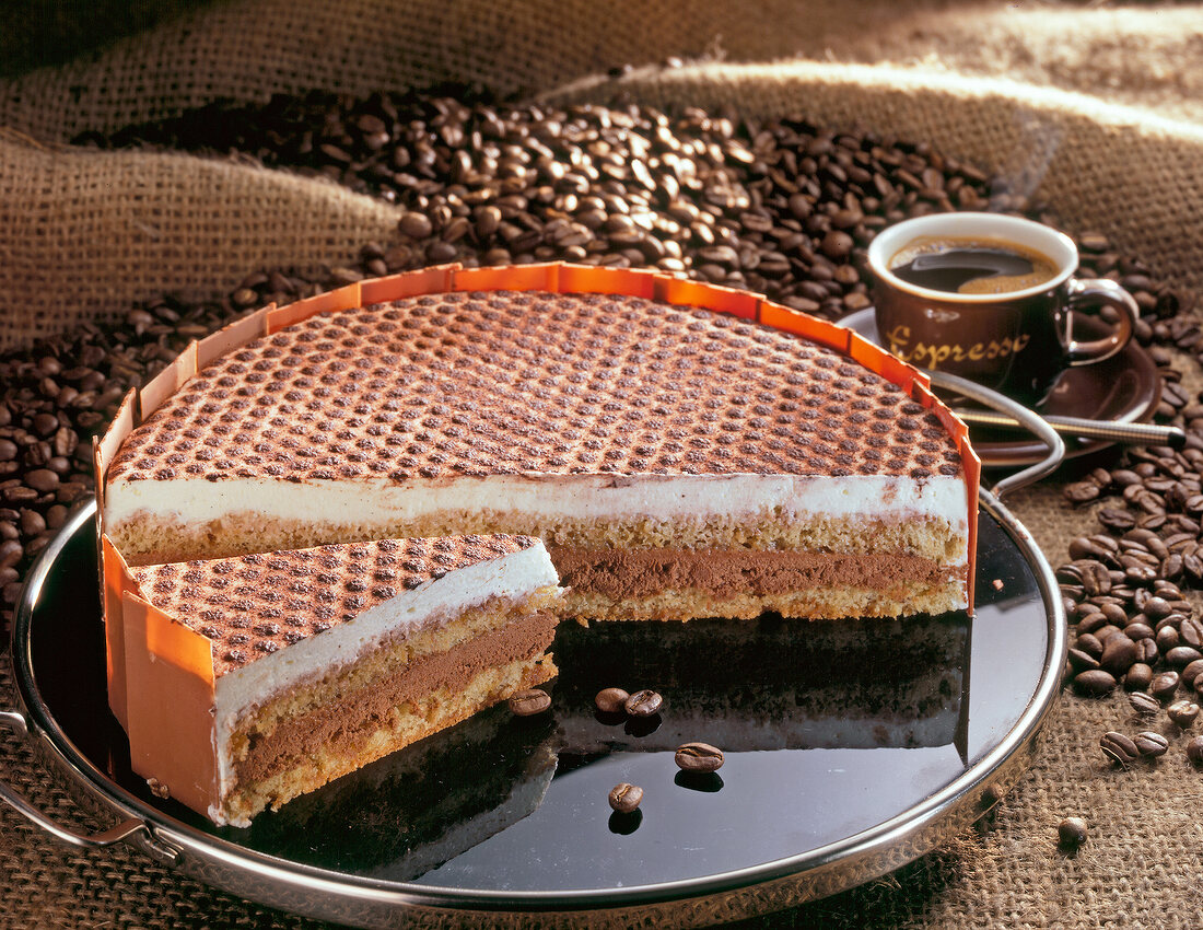 Espresso cream pie on plate with cup of coffee