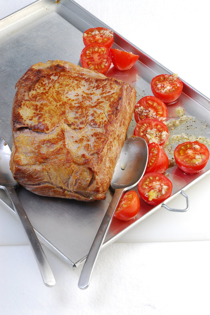 Roasted beef and marinated tomatoes on baking dish, step 2