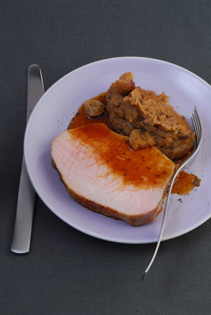 Pork loin with puree on plate