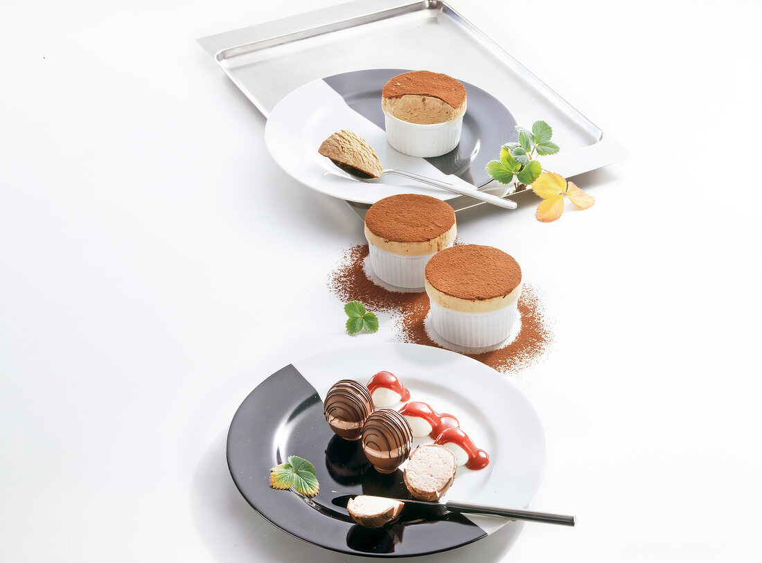 Chocolate souffle with strawberry chocolate on plates