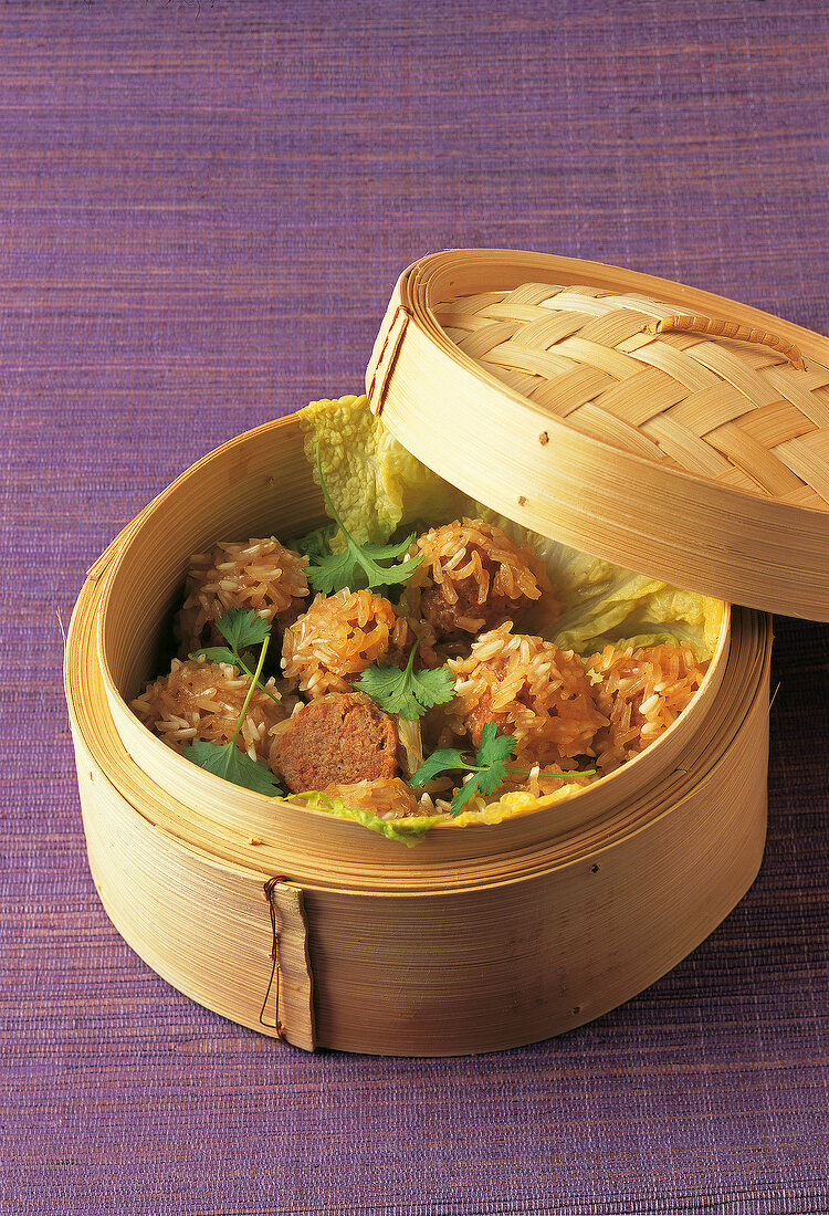 Rice balls with meat and Chinese cabbage in steaming basket