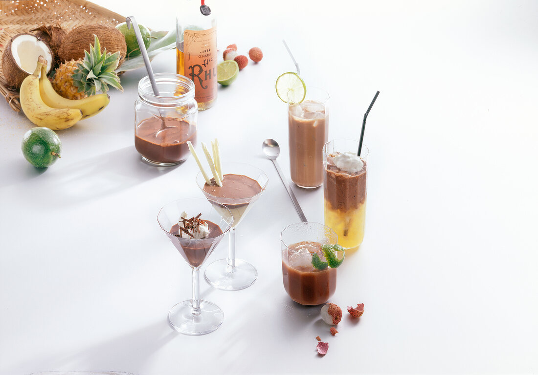 Variety of chocolate drinks on white background