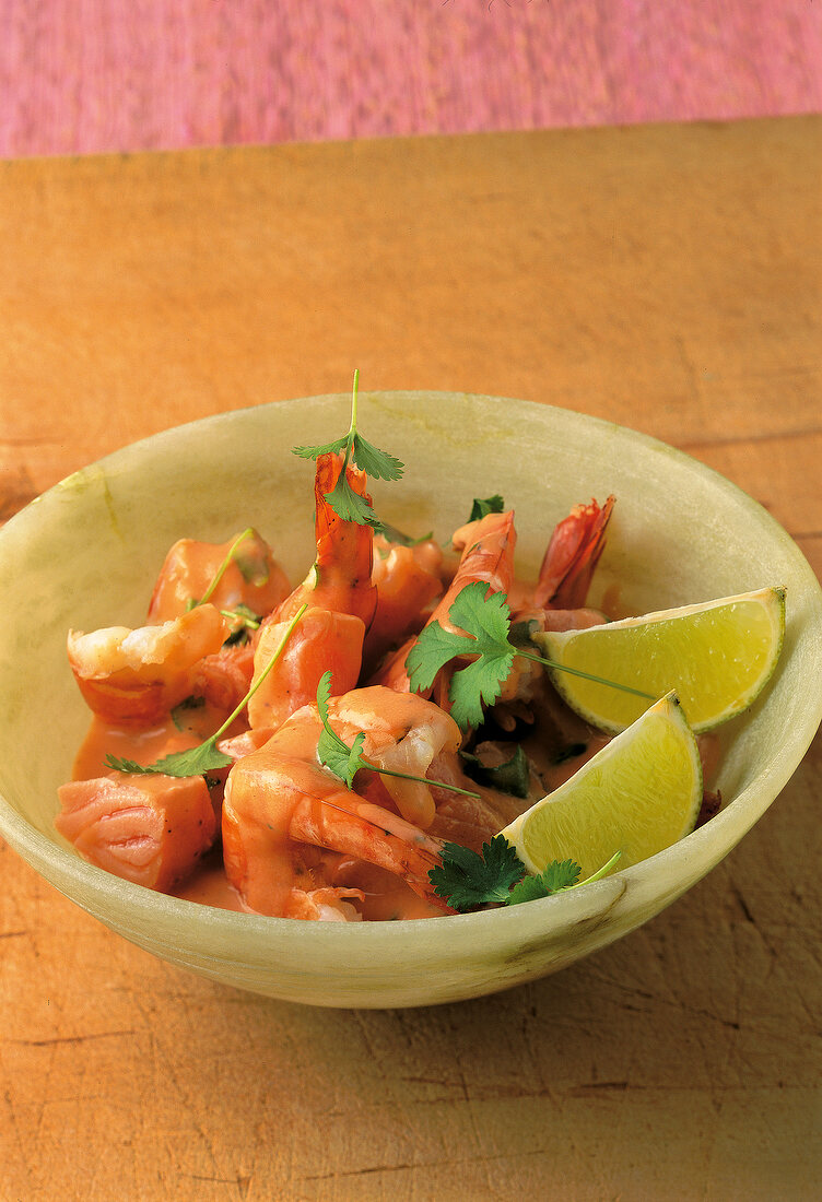 Salmon and shrimp with lime and coriander in bowl