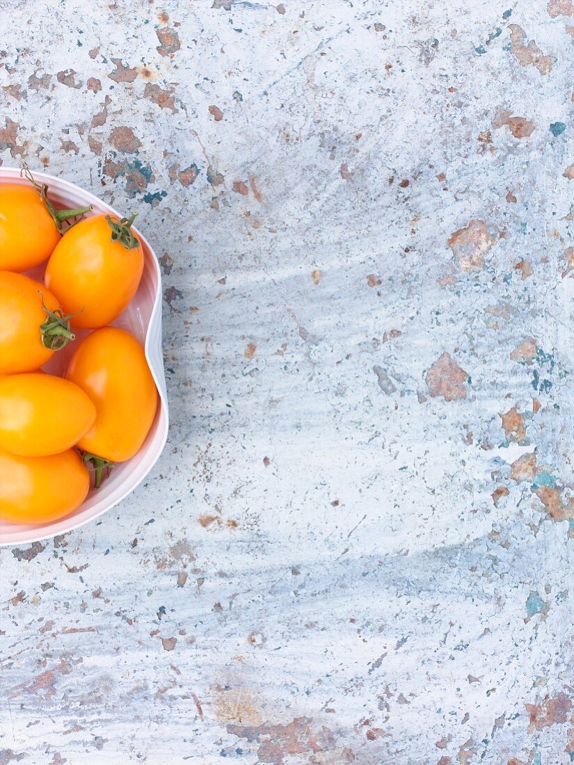 A bowl of yellow cocktail tomatoes