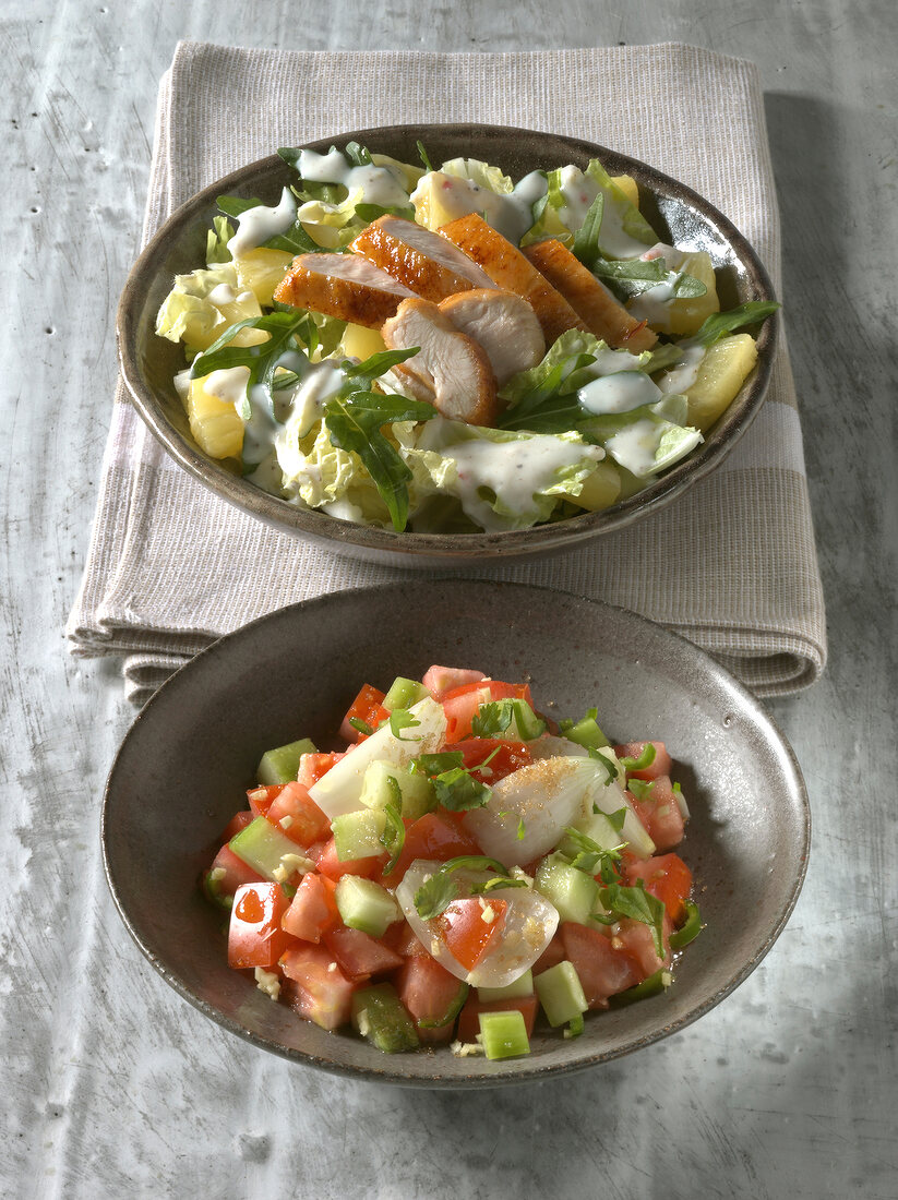 Malaysian salad with chicken, tomato and cucumber in bowl