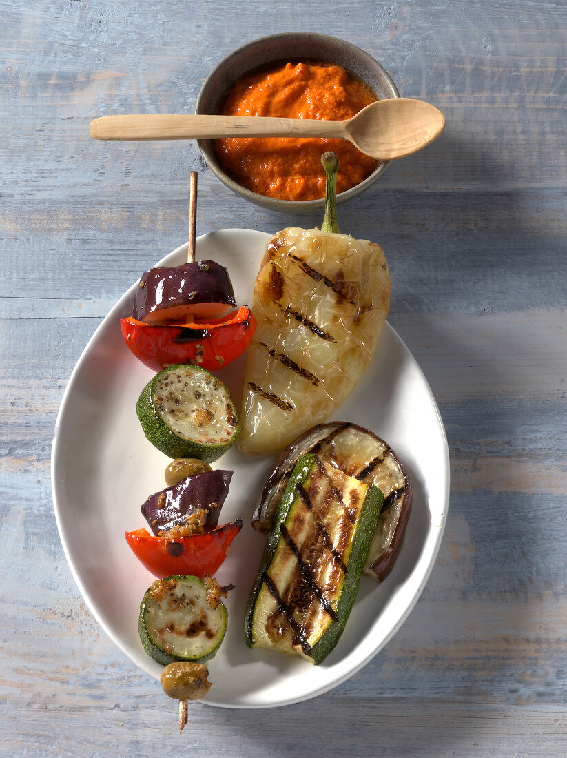 Ratatouille skewer with grilled vegetables and tomato sauce on plate