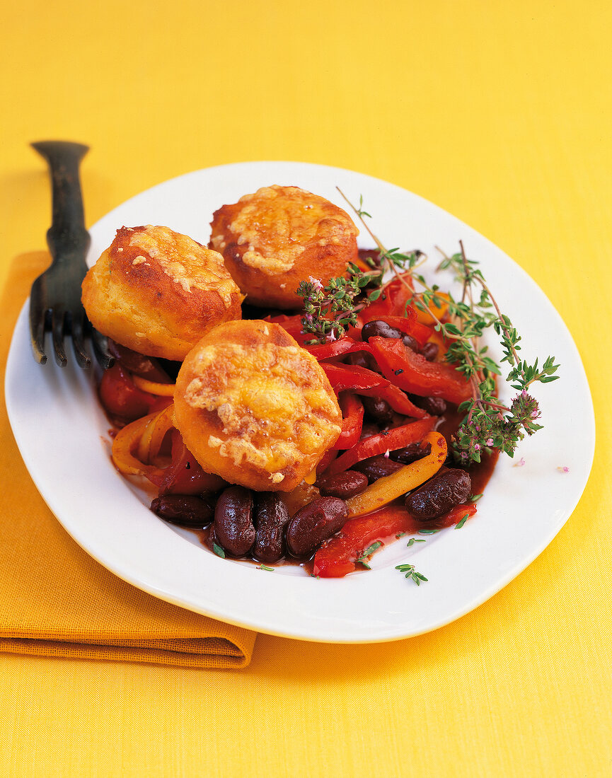 Corn yeast cakes with chilli vegetables on plate