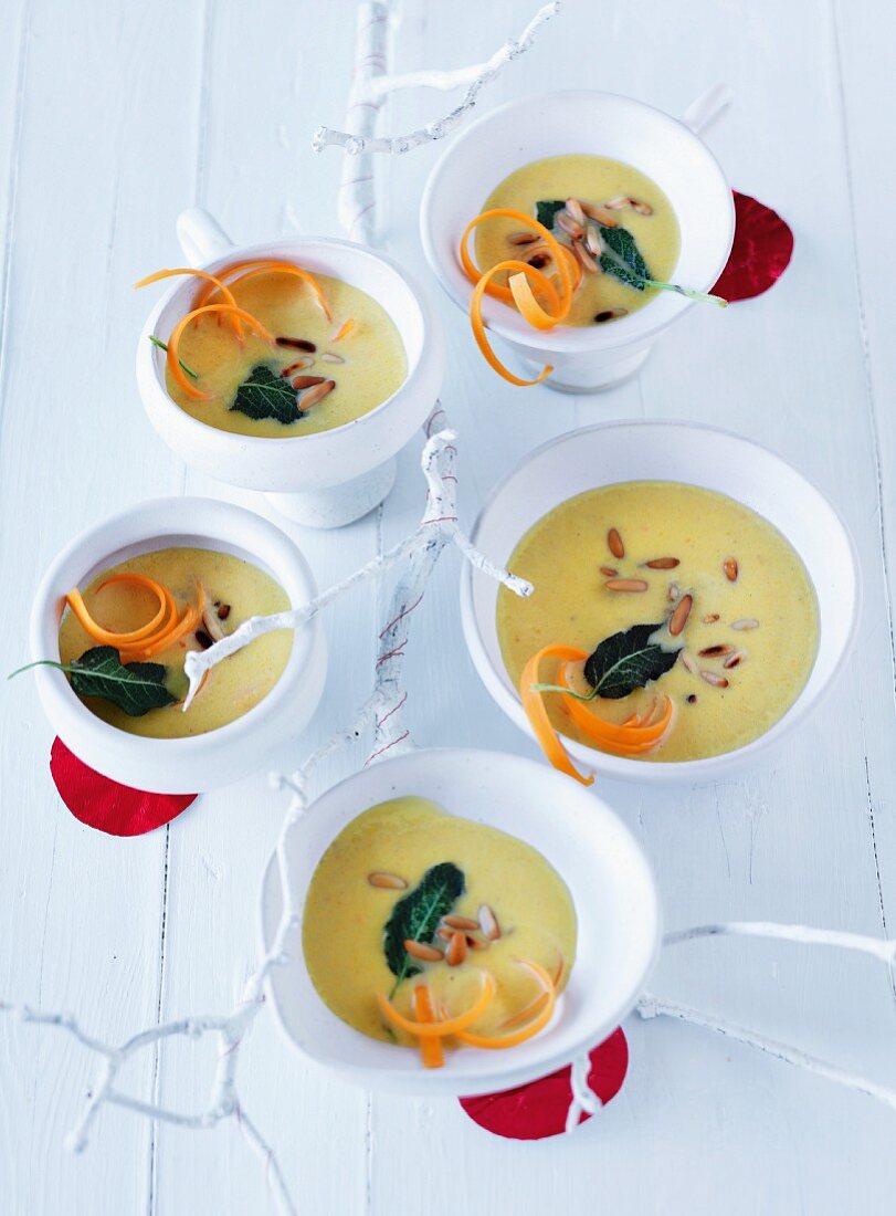 Turnip soup with pine nuts, shredded carrot and sage