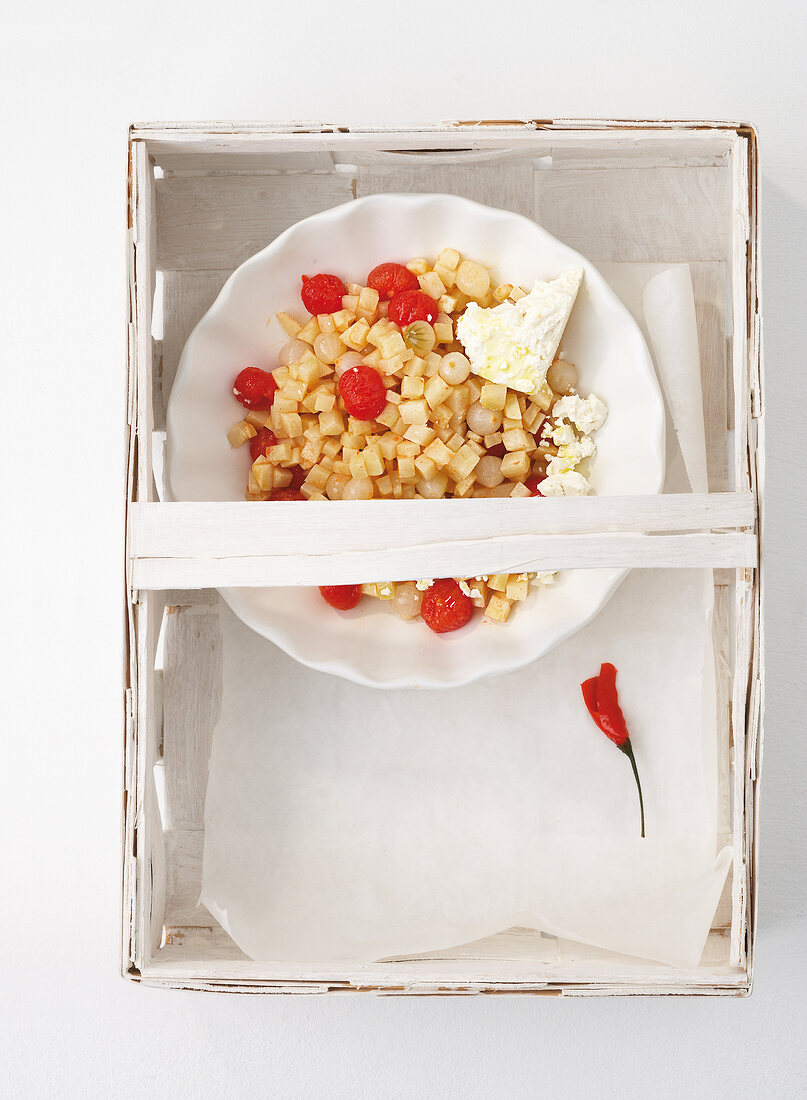 Bowl of celery salad in tray, overhead view