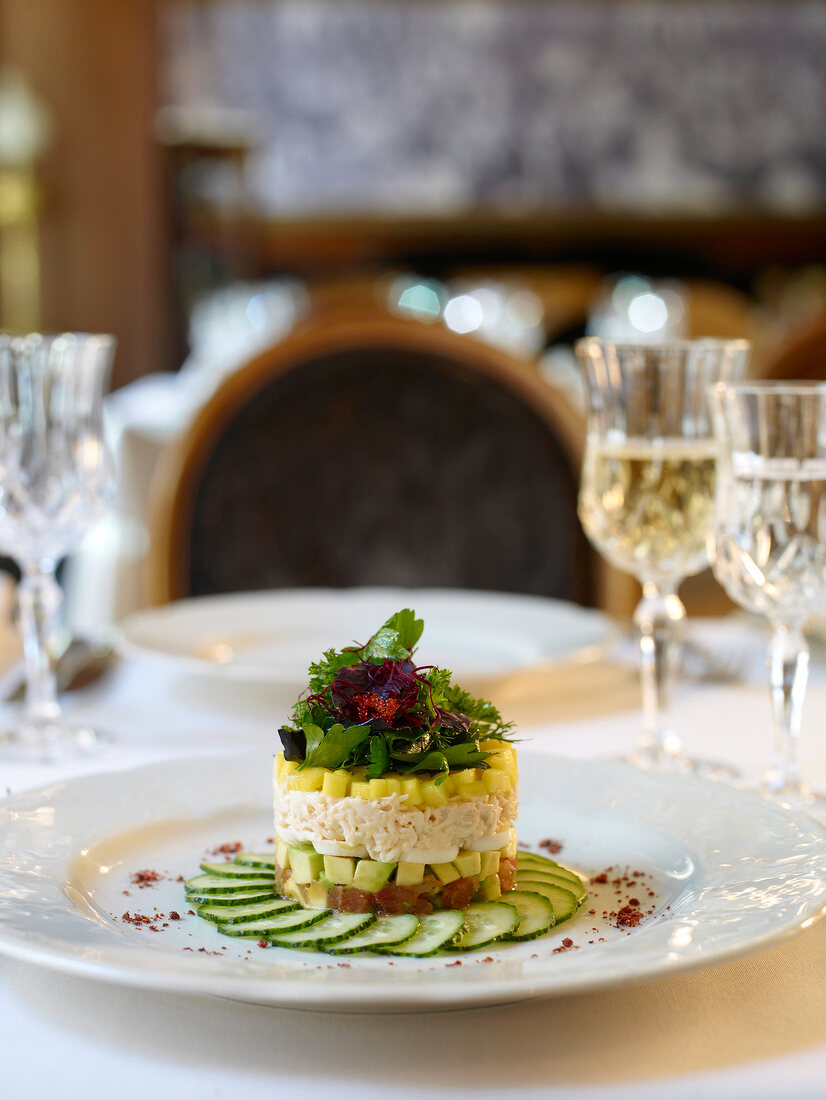 Close-up of layer salad with king crab on plate