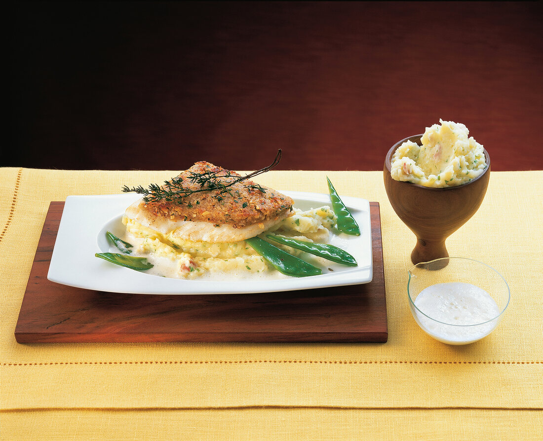 Turbot fillet with spicy crust on plate