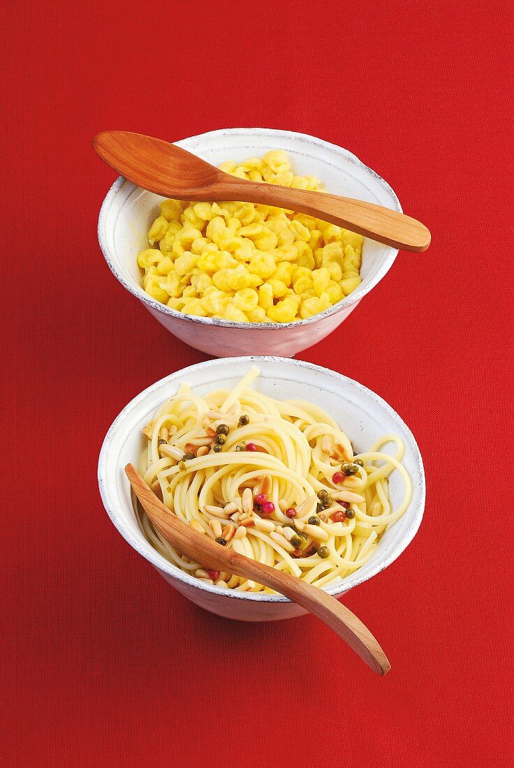 Saffron Spätzle (soft egg noodles from Swabia) and pasta with pine nuts and pepper