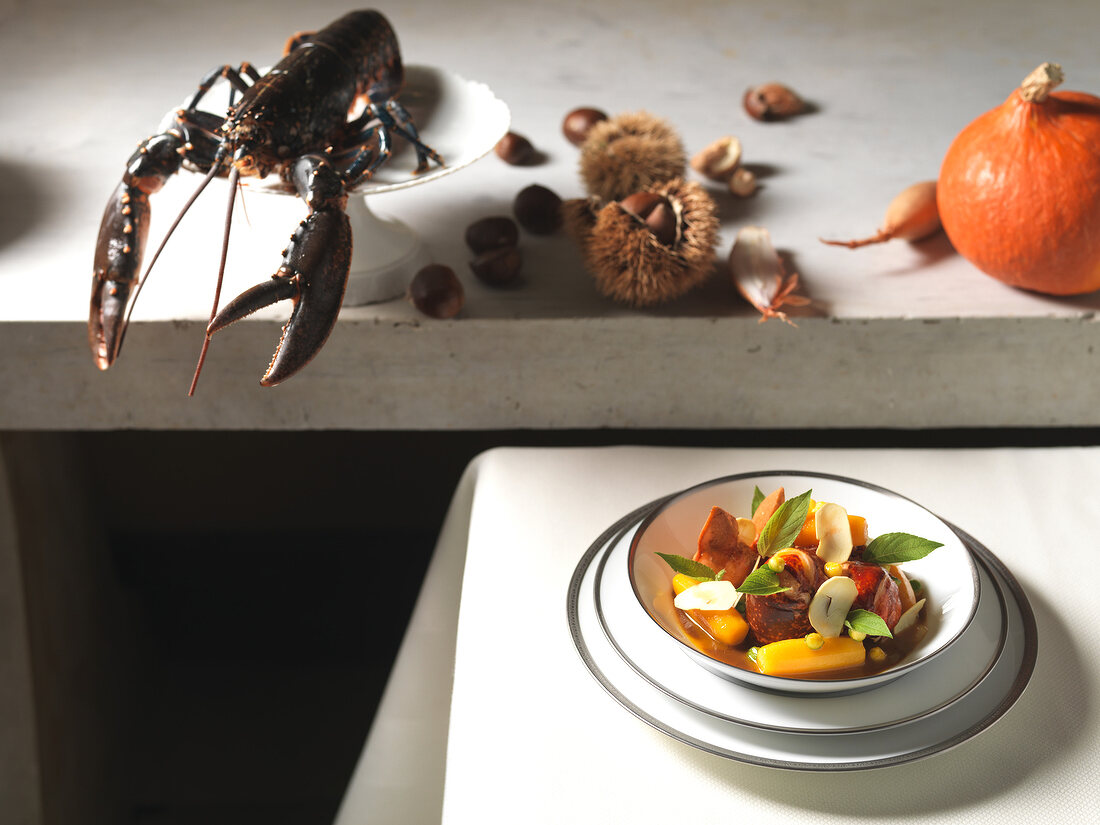 Lobster fricassee with chestnut and pumpkin in plate