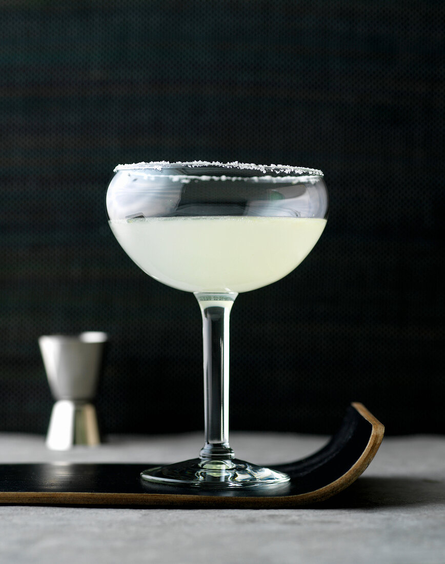 Classic margarita with salt rim in cocktail glass