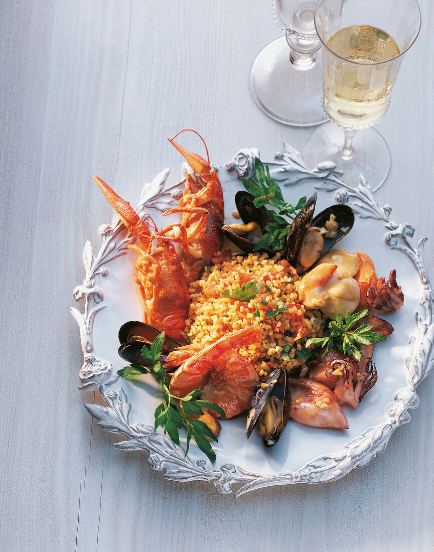 Seafood with fried bulgur on plate