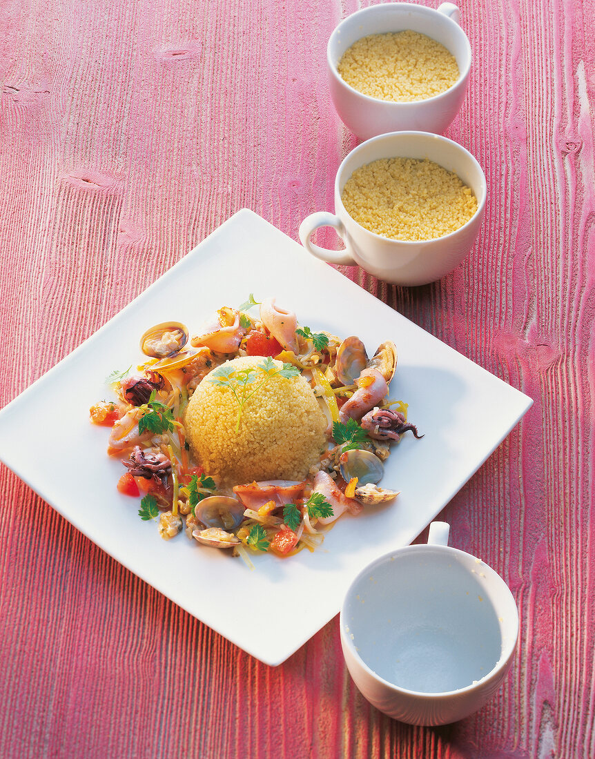 Couscous gugelhupf with seafood on plate