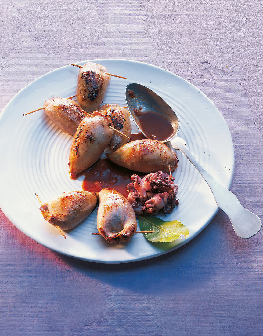 Squid and smouldered rabbit on plate