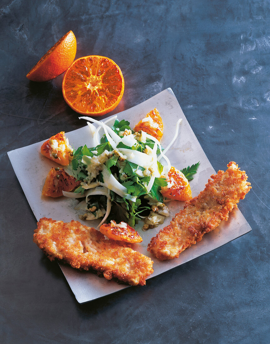 Christmas carp with salad on plate