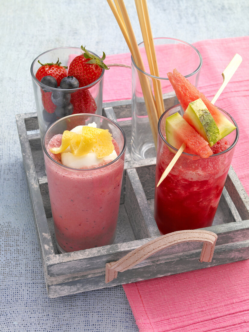 Ha-Ha-smoothie and red fizz smoothie with berries and melon in glass