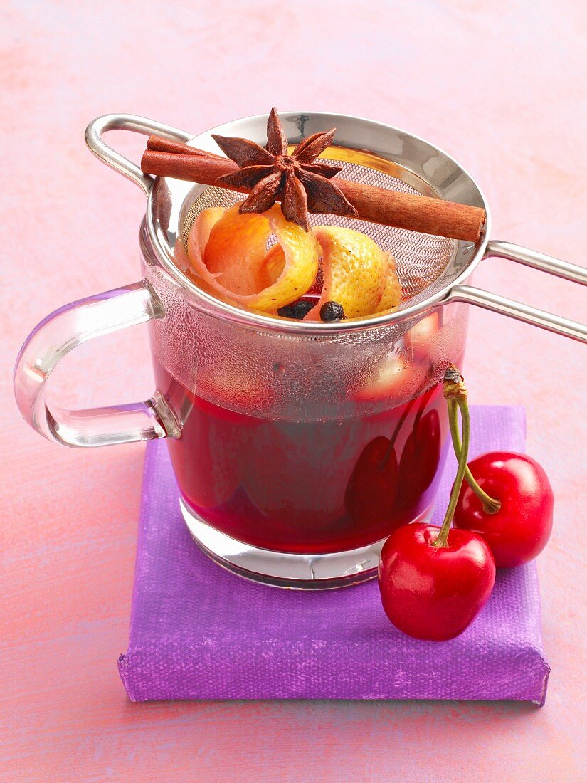 Cherry and almond punch with cinnamon, star anise and cherries