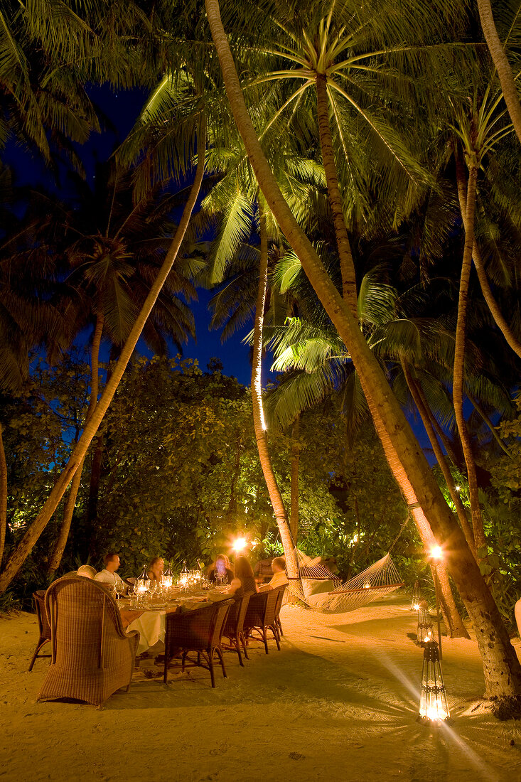 People having dinner at Dhigufinolhu island in Maldives