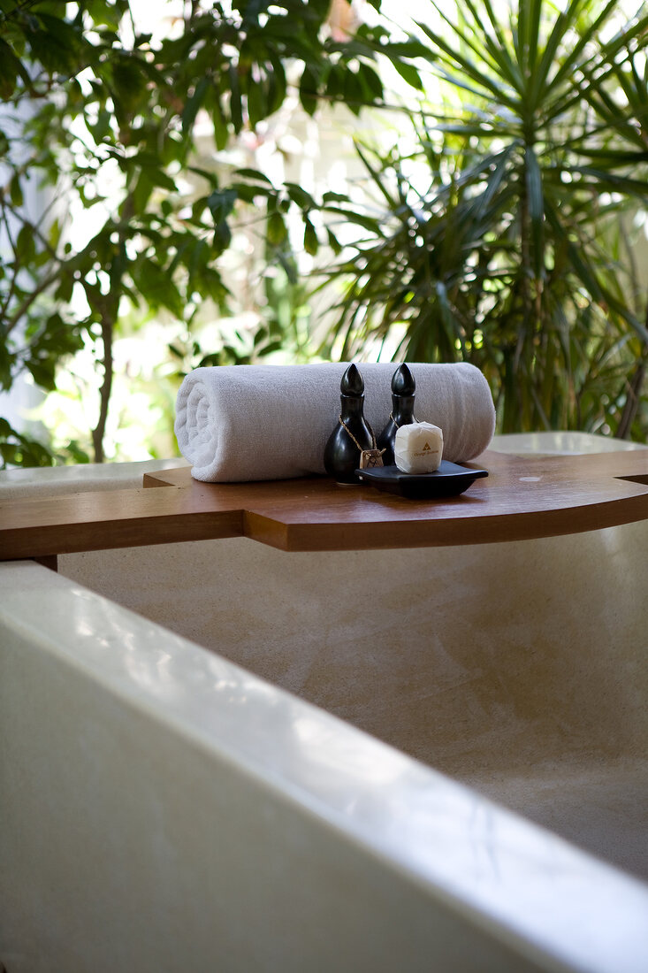 Bathtub and rolled towel in bathroom at Dhigufinolhu island, Maldives
