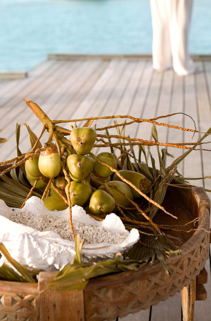 Small coconut bunches wooden table in Dhigufinolhu Island, Maldives