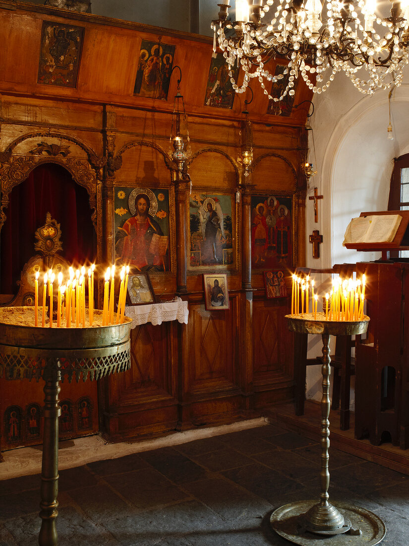 Lit candles in church on Pelion Mountain, Eastern Magnesia, Greece