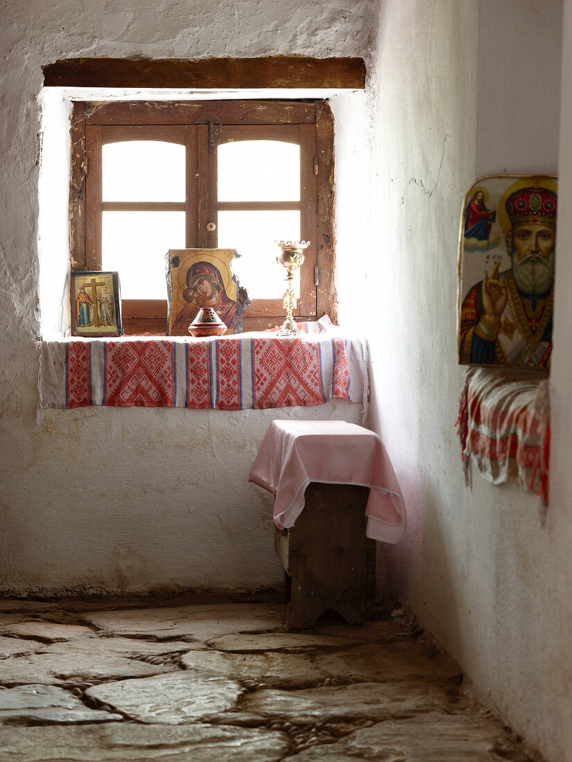 Religious icons on window sill in church on Pelion Mountain, Eastern Magnesia, Greece